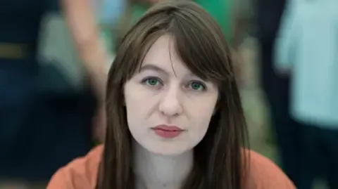 The acclaimed novelist claims she will not enter the UK over potential arrest